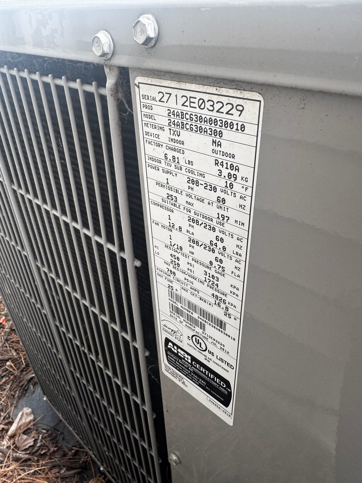 Outdoor AC condenser nameplate (Carrier 24ABC6, 2012)